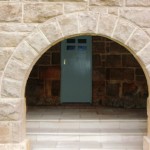 The stone archway maintains the structural strength of the lower ground floor.